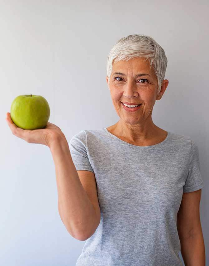 Close Up Female Teacher Holding Green Apple