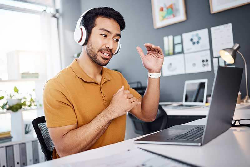 Male Teacher Talking With Hands Video Call Home Office