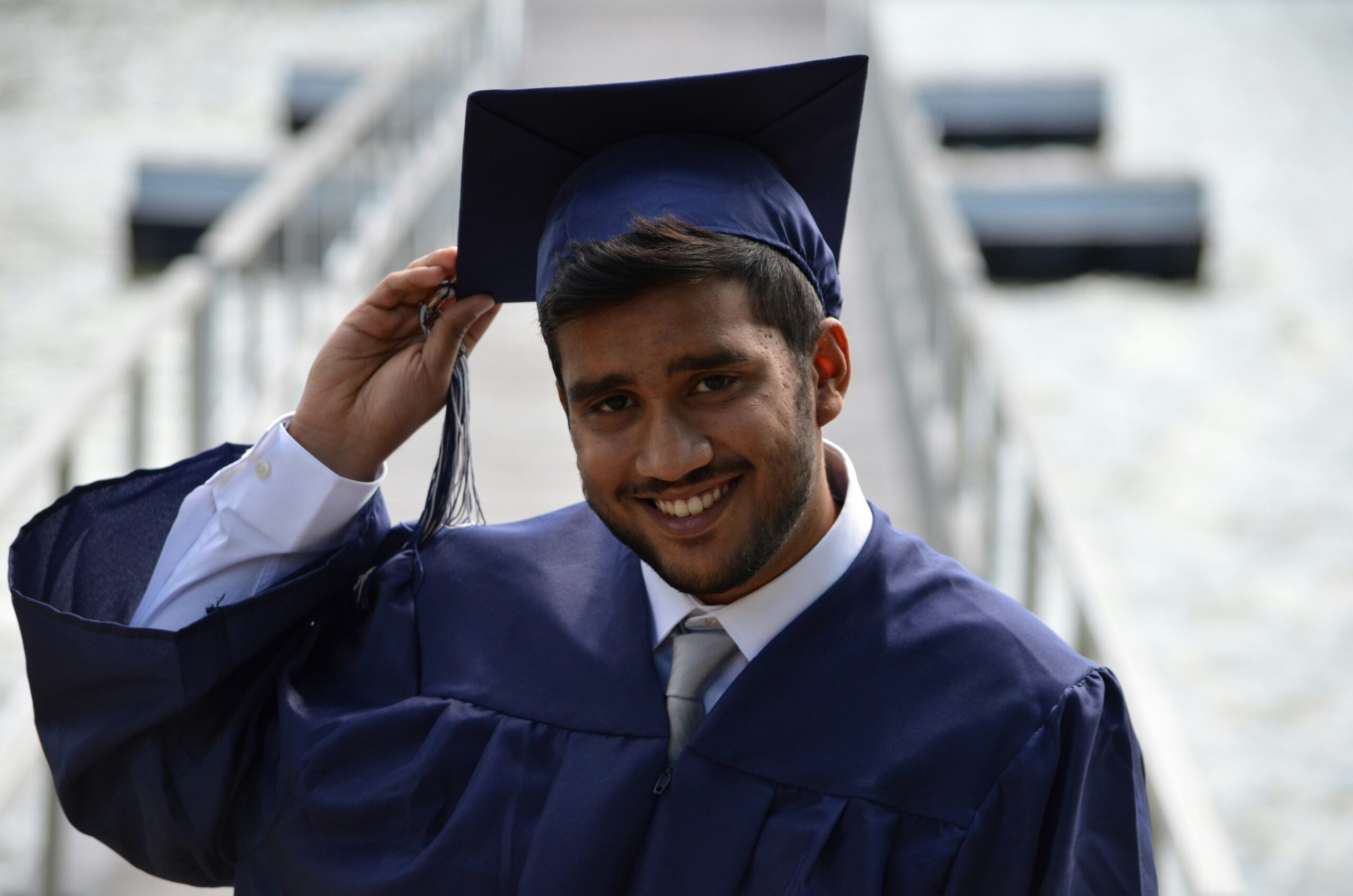 A person in a cap in gown on their graduation day