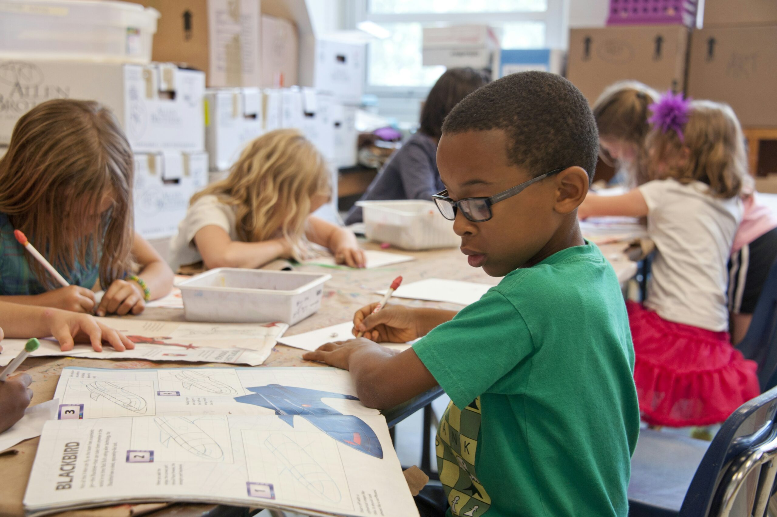 A young student taking a quiz in a classroom